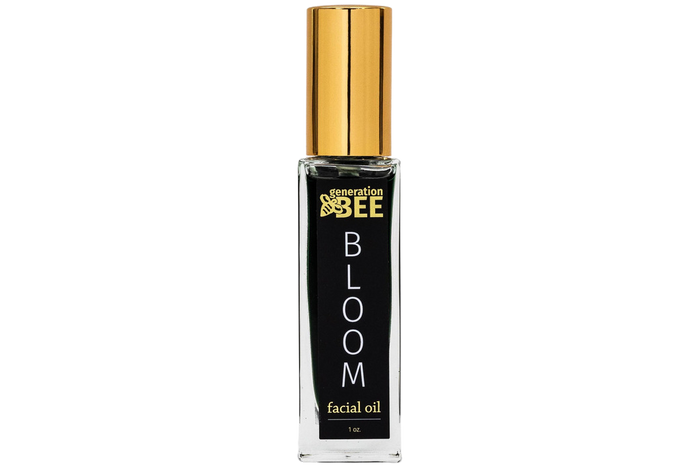 Bottle of 'Bloom' facial oil by generation bee on a white background