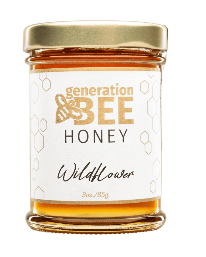 Jar of Generation & Bee Wildflower honey on a white background

