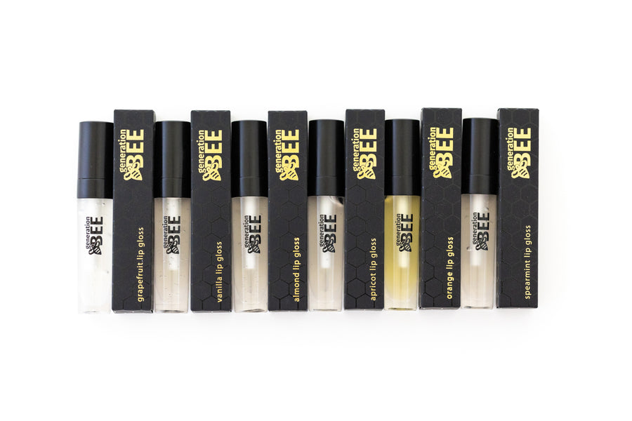 A collection of Generation Bee lip gloss tubes in various colors
