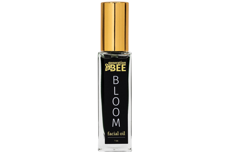 Bottle of 'Bloom' facial oil by generation bee on a white background

