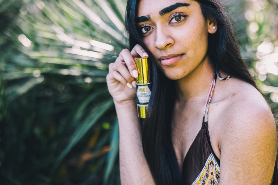 Model posing with generation Bee fical cosmetics