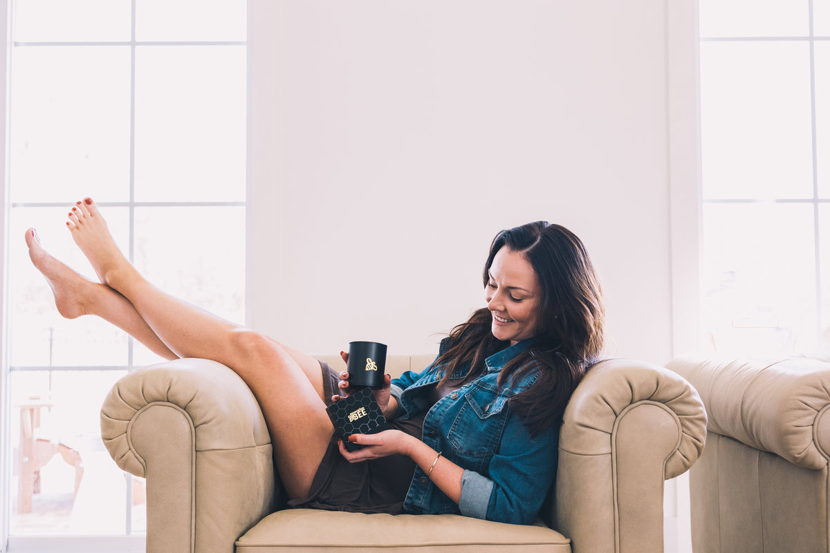 Woman opening a Generation Bee candle box