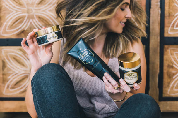 Young woman holds Generation Bee cosmetics